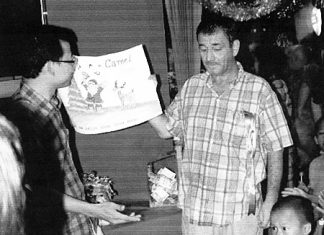 Chris “Quinny” Quinn (right) with Father Peter at the Christmas Day Camel Bar lunch for the children of the Camillian Centre in Rayong.